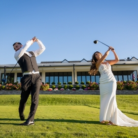 Bride and groom teeing off at SkyView golf club
