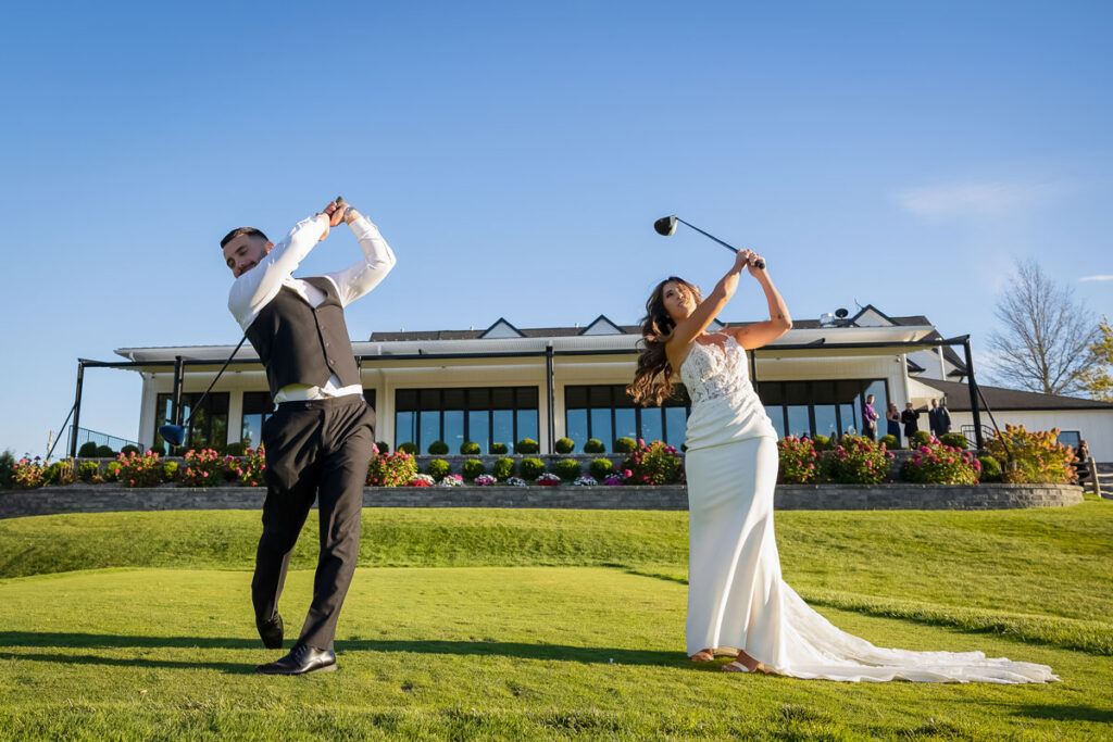 Bride and groom teeing off at SkyView Golf Club in New Jersey.