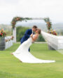 Wedding couple kissing at alter at SkyView golf course outside